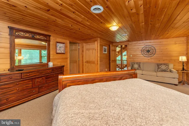 a bedroom with a bed and a table in it