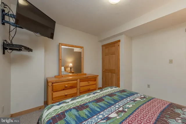 a view of a porch with furniture and wooden floor