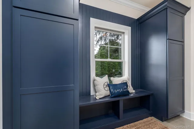 a room with wooden floor and a window