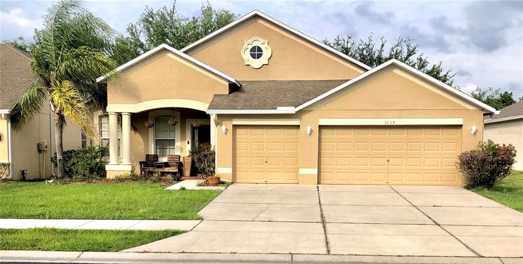 3739 Bramblewood Loop Spring Hill, FL 34609 - Photo 1 of 1 a view of outdoor space yard and front view of a house
