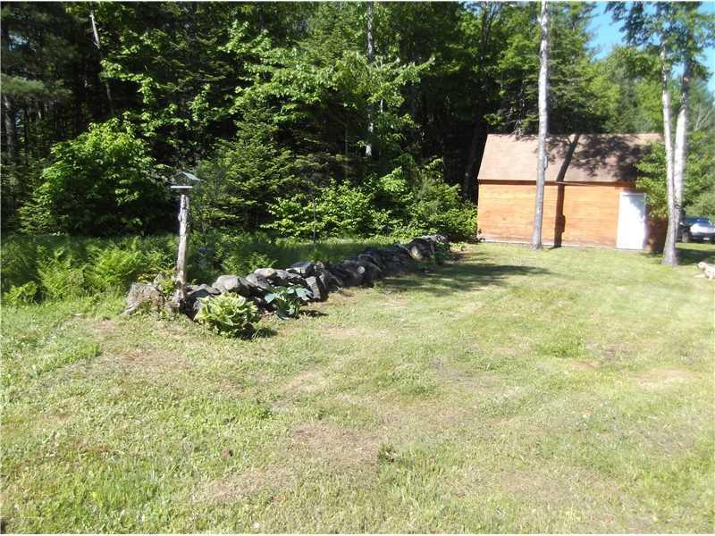 60 Bridge Road Parkman, ME 04443 - Photo 15 of 16 Garage. Side view of garage and rock...