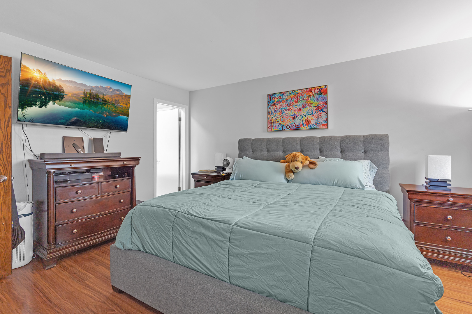 11020 Raleigh Street Westchester, IL 60154 - Photo 15 of 27 a bedroom with a bed and a flat screen tv