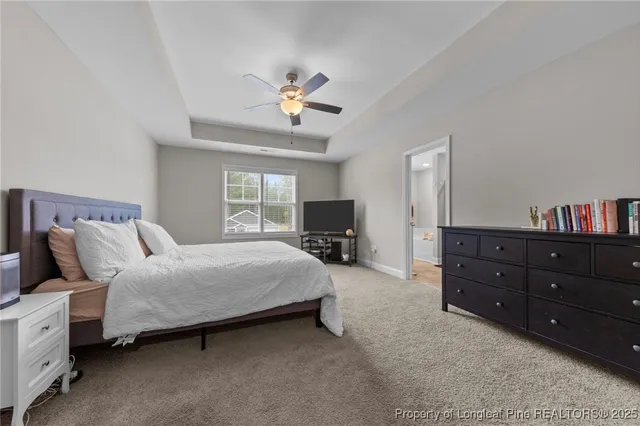 a bathroom with a granite countertop sink a mirror and a shower