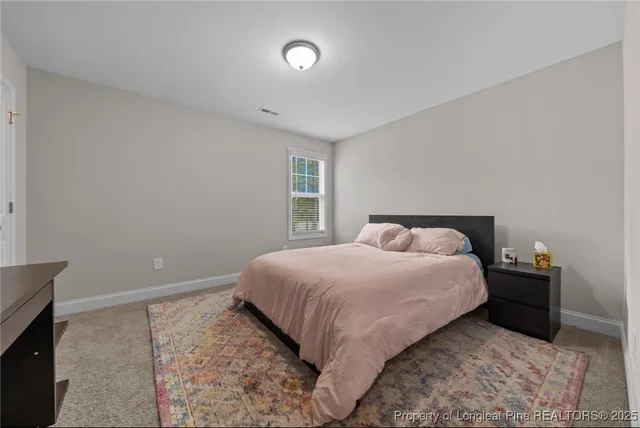 a view of room with windows and air conditioner