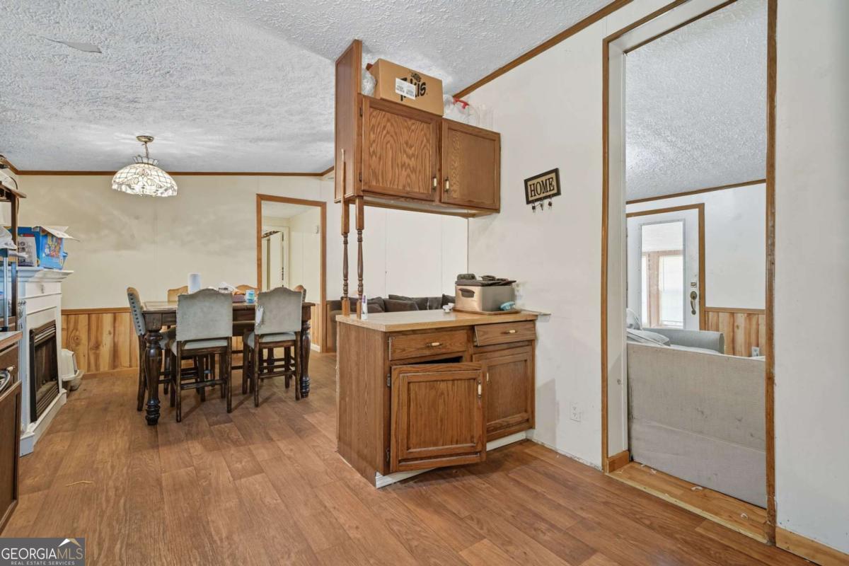 2450 Jones Mountain Road Talking Rock, GA 30175 - Photo 21 of 40 a kitchen with stainless steel appliances granite countertop a refrigerator and microwave