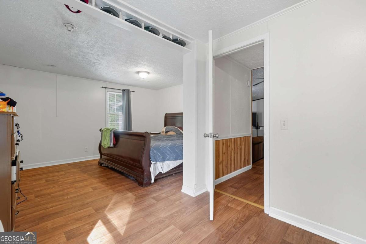 2450 Jones Mountain Road Talking Rock, GA 30175 - Photo 25 of 40 a living room with furniture and a table