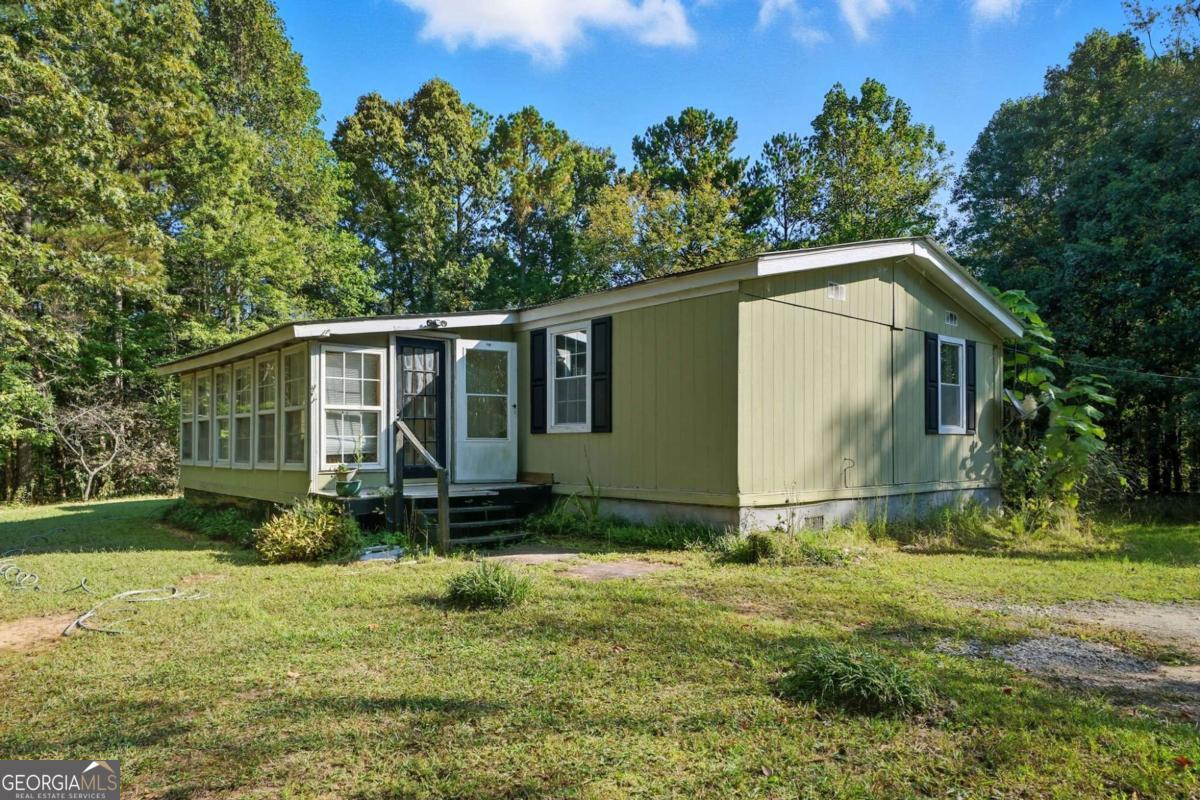 2450 Jones Mountain Road Talking Rock, GA 30175 - Photo 37 of 40 a backyard of a house with lots of green space