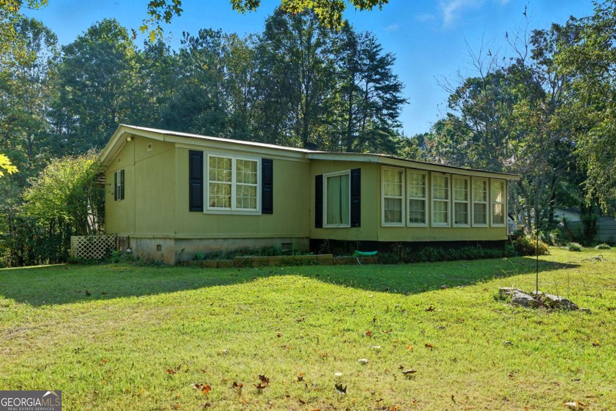 2450 Jones Mountain Road Talking Rock, GA 30175 - Photo 38 of 40 a view of a house with a backyard