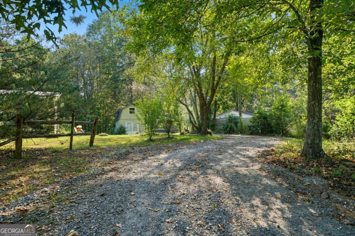 2450 Jones Mountain Road Talking Rock, GA 30175 - Photo 40 of 40 a backyard of a house with lots of green space