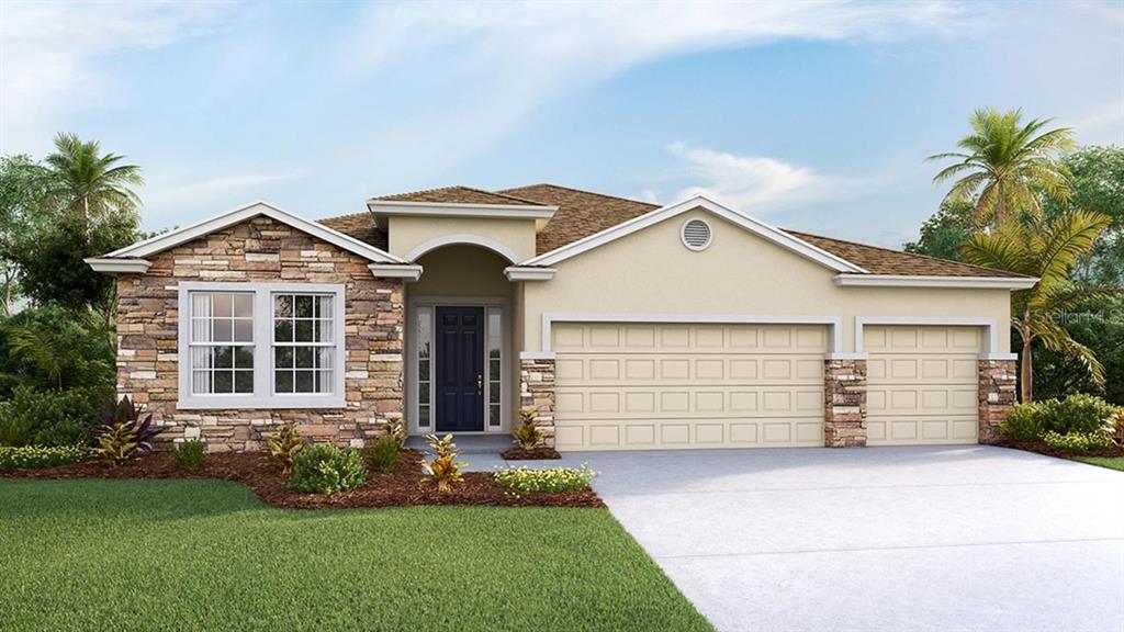 13114 Pepper Stem St Spring Hill Spring Hill, FL 34609 - Photo 1 of 1 a front view of a house with a garden and yard