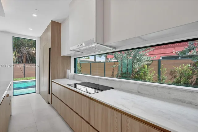 a bathroom with a sink a mirror a shower and vanity