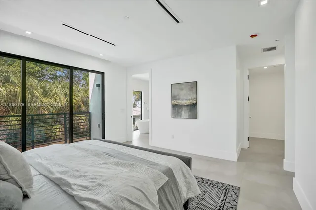 an aerial view of a residential apartment building with a yard