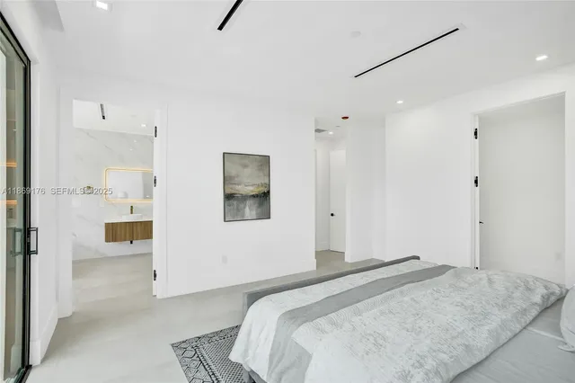 an aerial view of a house with swimming pool and porch