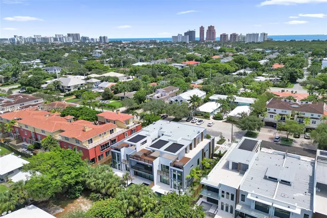 a living room with fireplace furniture and a wooden floor