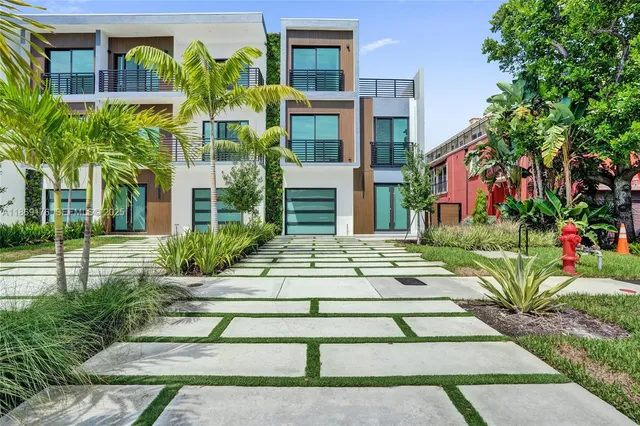 a dining room with furniture a large window and a dining table