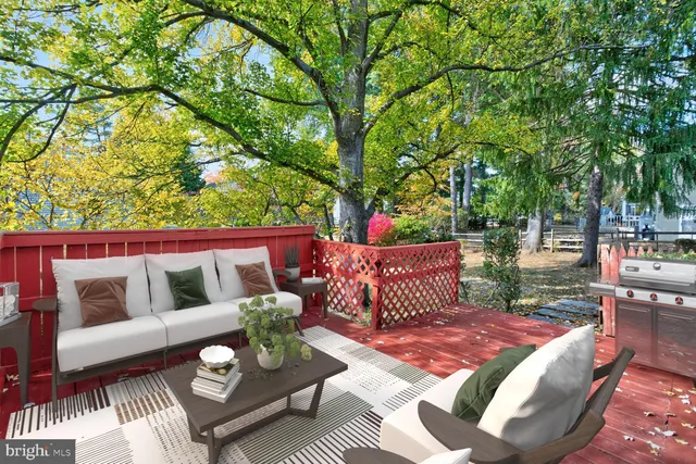 a outdoor living space with furniture and a potted plant