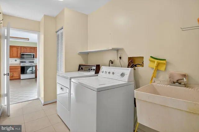 a utility room with dryer and washer