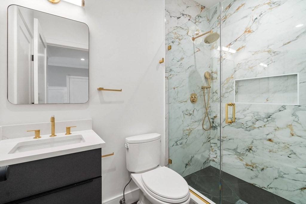 258 Greendale Avenue Needham, MA 02494 - Photo 11 of 23 a bathroom with a sink toilet and shower