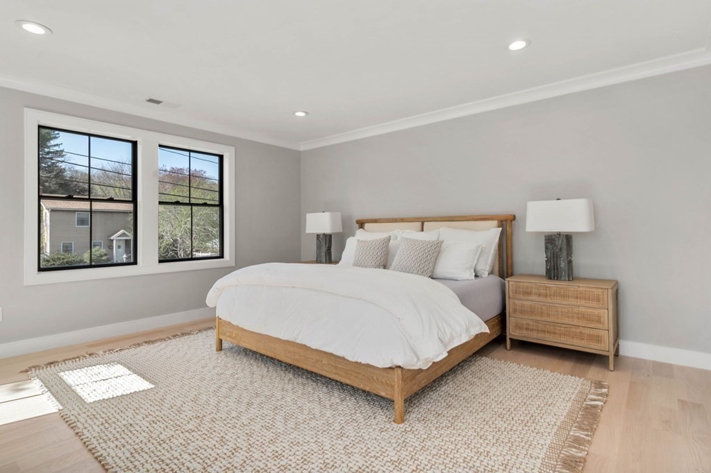 258 Greendale Avenue Needham, MA 02494 - Photo 13 of 23 a bedroom with a bed lamp and window