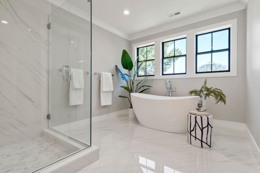 258 Greendale Avenue Needham, MA 02494 - Photo 15 of 23 a white bath tub sitting next to a window