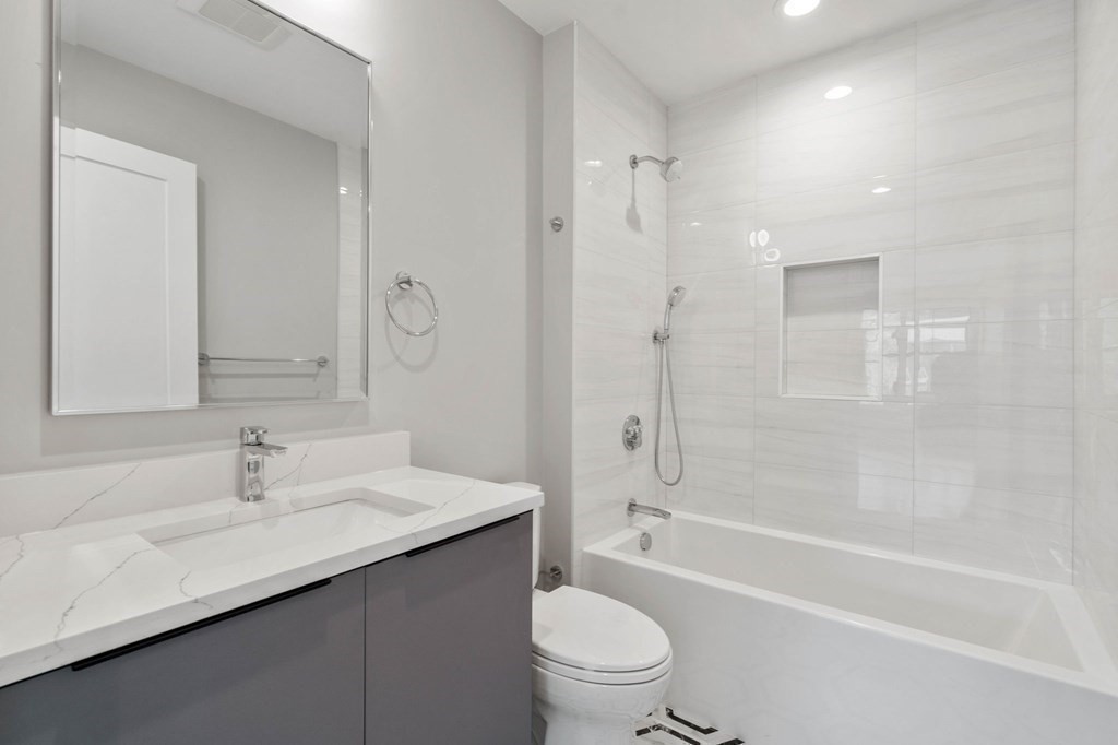 258 Greendale Avenue Needham, MA 02494 - Photo 18 of 23 a bathroom with a sink a toilet and shower