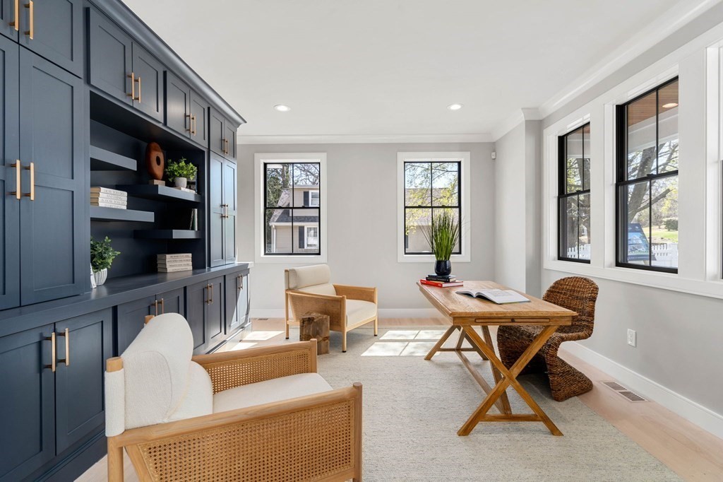 258 Greendale Avenue Needham, MA 02494 - Photo 2 of 23 a living room with furniture a flat screen tv and a window