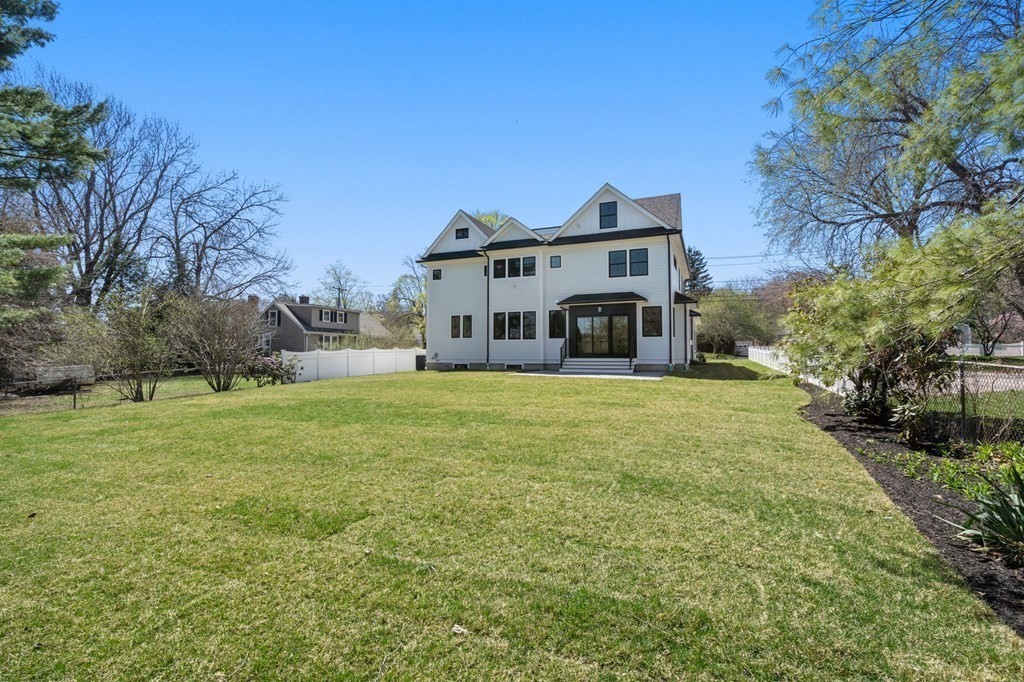 258 Greendale Avenue Needham, MA 02494 - Photo 23 of 23 a large house with a big yard and large trees