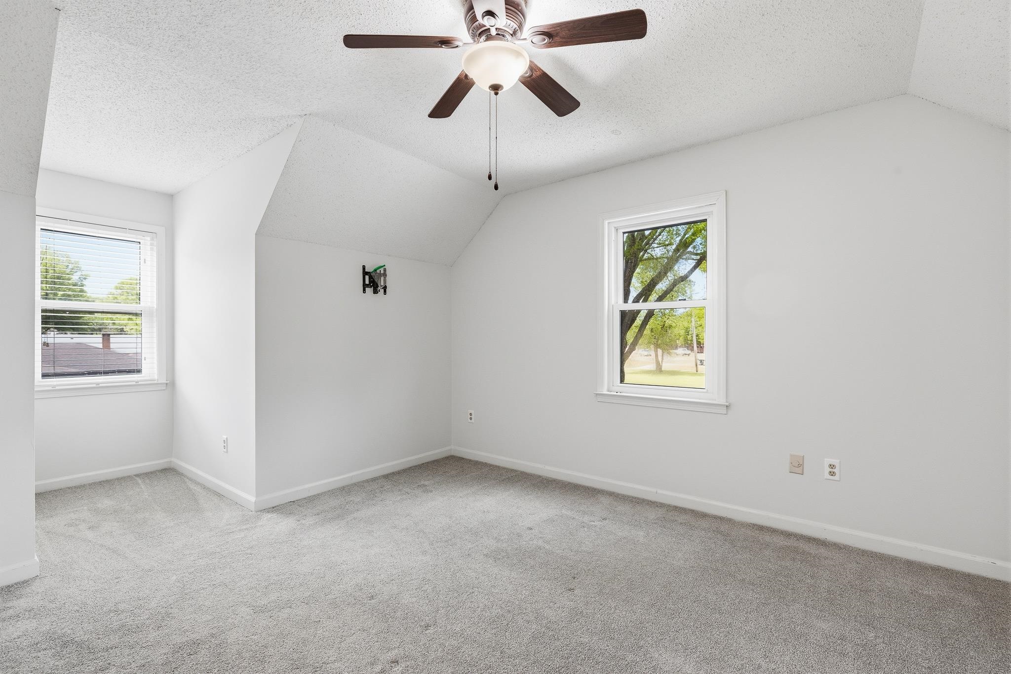 1234 Greenview Road Collierville, TN 38017 - Photo 26 of 33 an empty room with windows and chandelier fan
