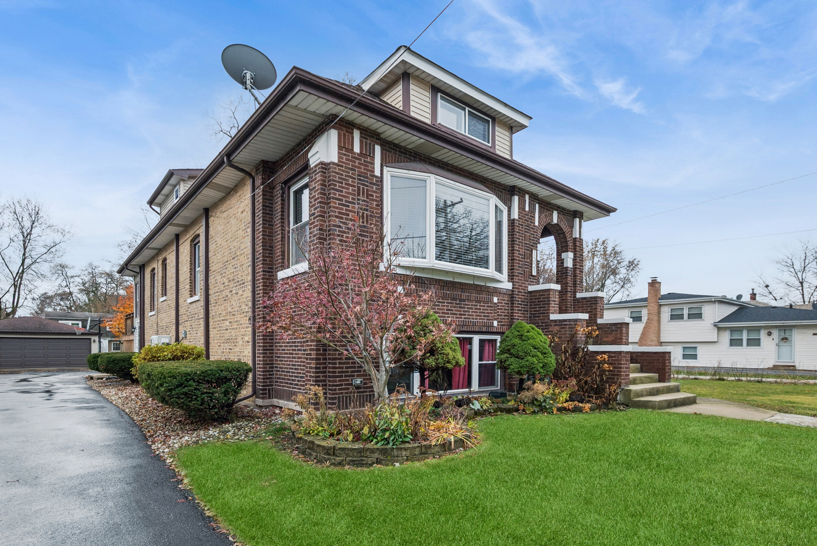 1321 Ridge Road Homewood, IL 60430 - Photo 1 of 25 a front view of house with a garden