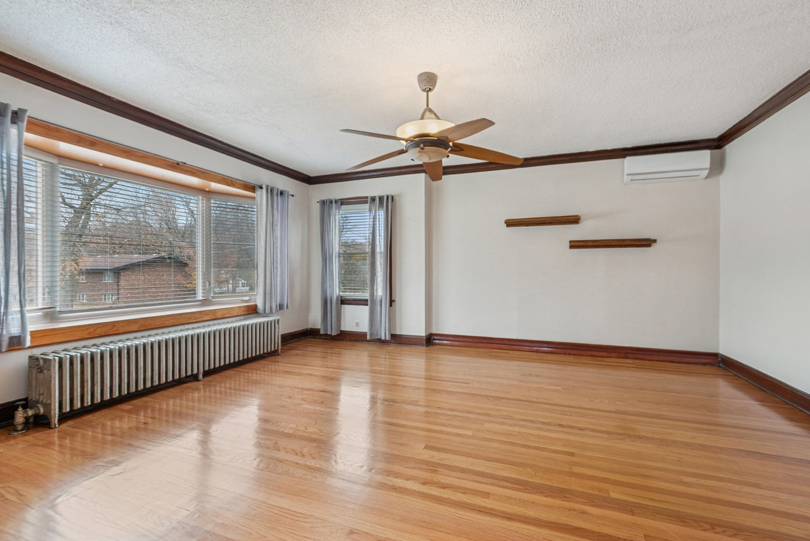 1321 Ridge Road Homewood, IL 60430 - Photo 3 of 25 a view of an empty room with wooden floor and a window
