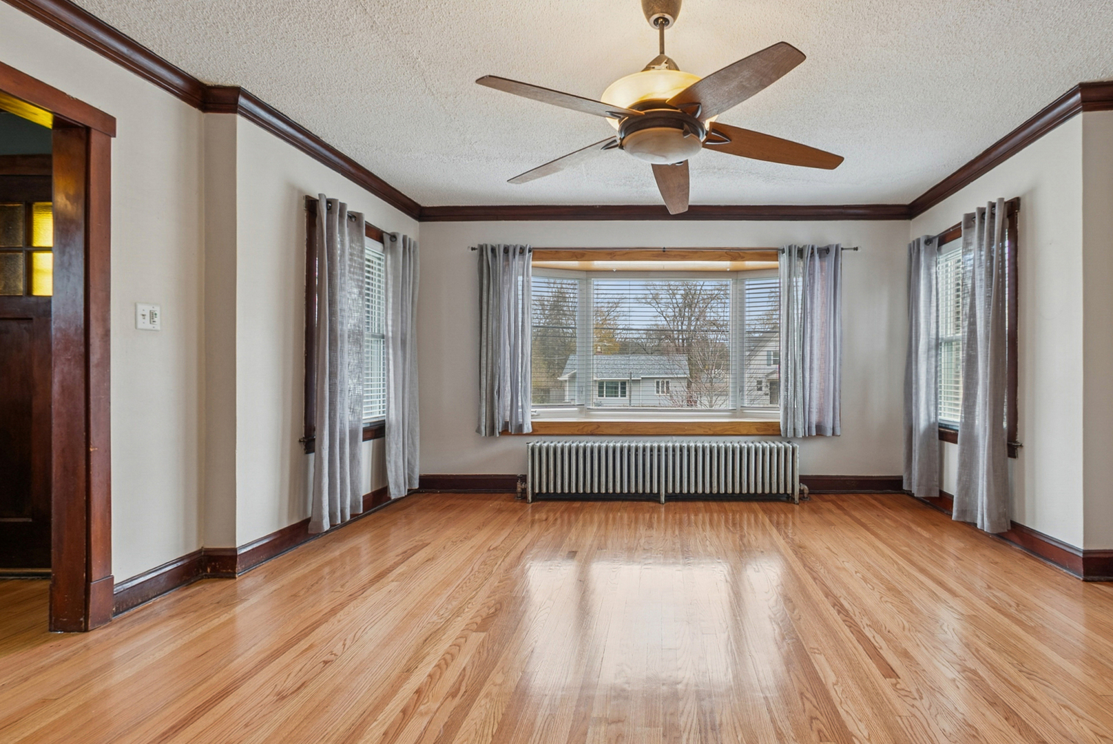 1321 Ridge Road Homewood, IL 60430 - Photo 4 of 25 wooden floor in an empty room with a window