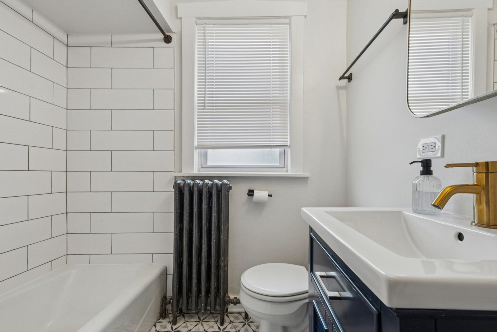 1321 Ridge Road Homewood, IL 60430 - Photo 10 of 25 a bathroom with a sink and a bathtub