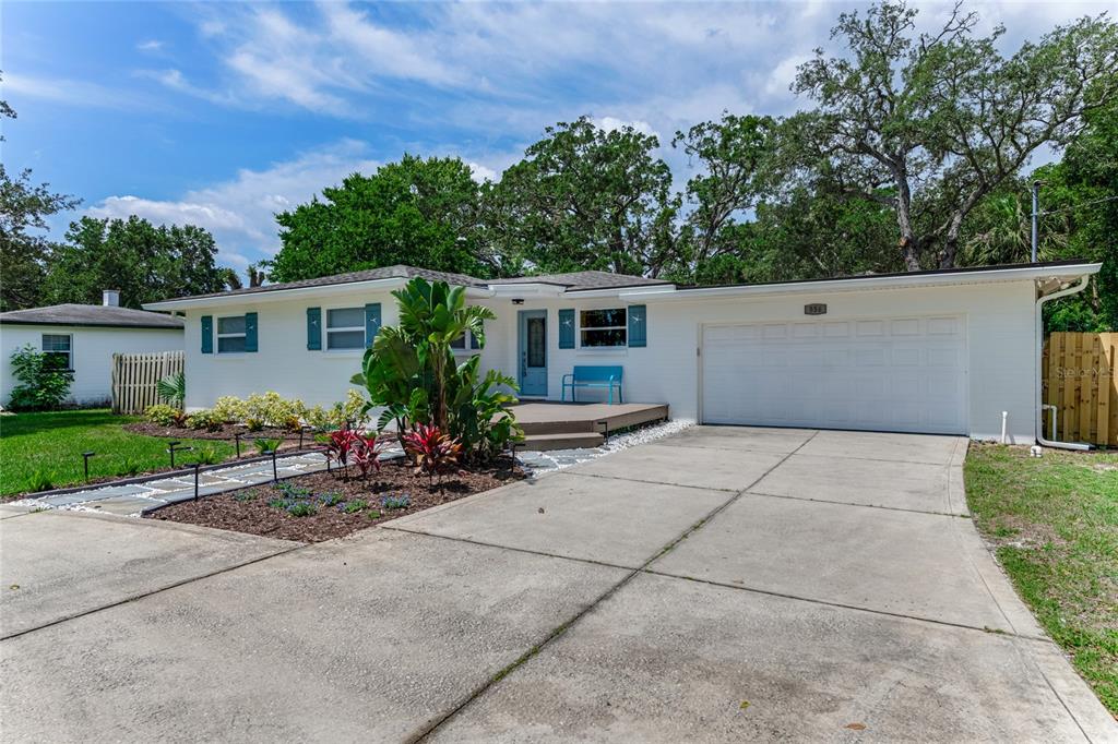 556 North Beach Street Ormond Beach, FL 32174 - Photo 1 of 1 a view of a house with yard and a garage