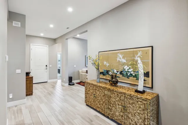 a bathroom with a sink a toilet a mirror and shower