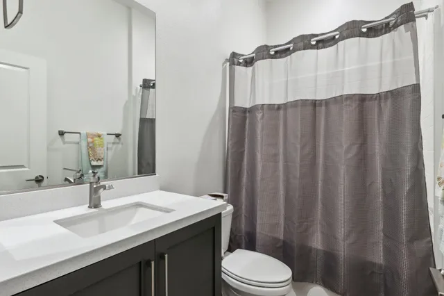 a view of a yard with a wooden fence