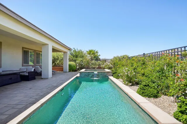 a view of a house with pool table and chairs
