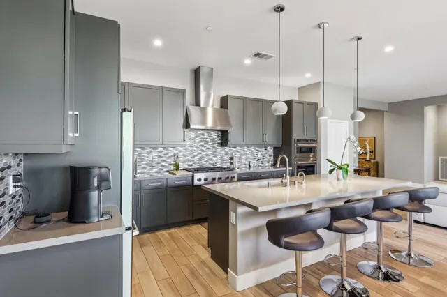 a living room with furniture rug and a window