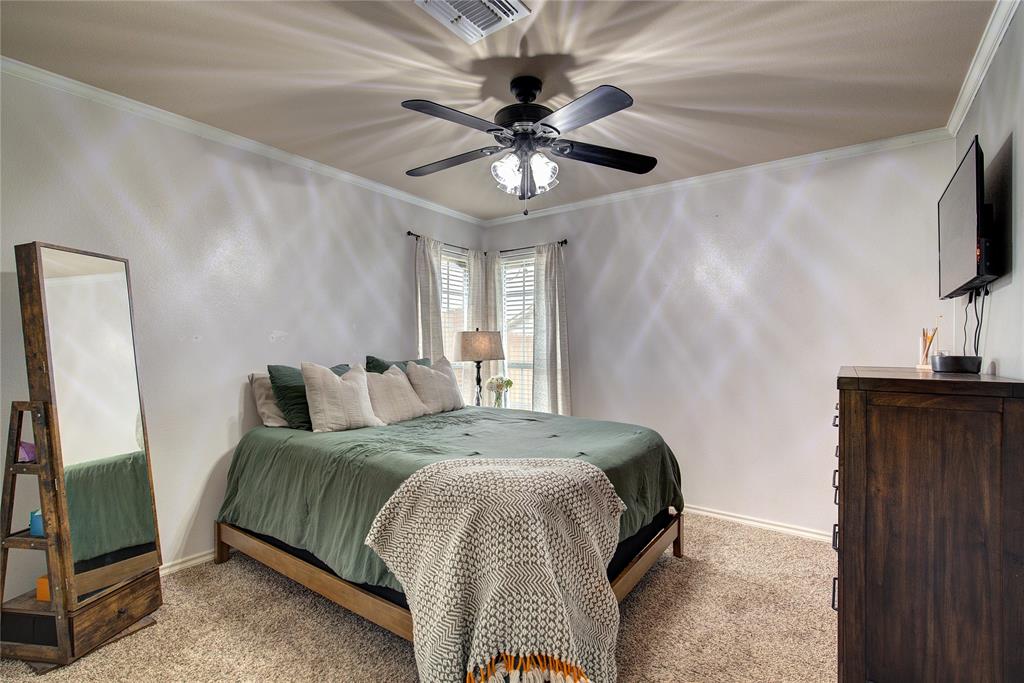 2027 Park Springs Road Sulphur Springs, TX 75482 - Photo 27 of 39 a bedroom with a bed and a flat screen tv