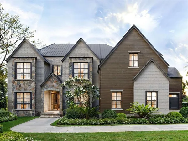 front view of brick house with a yard