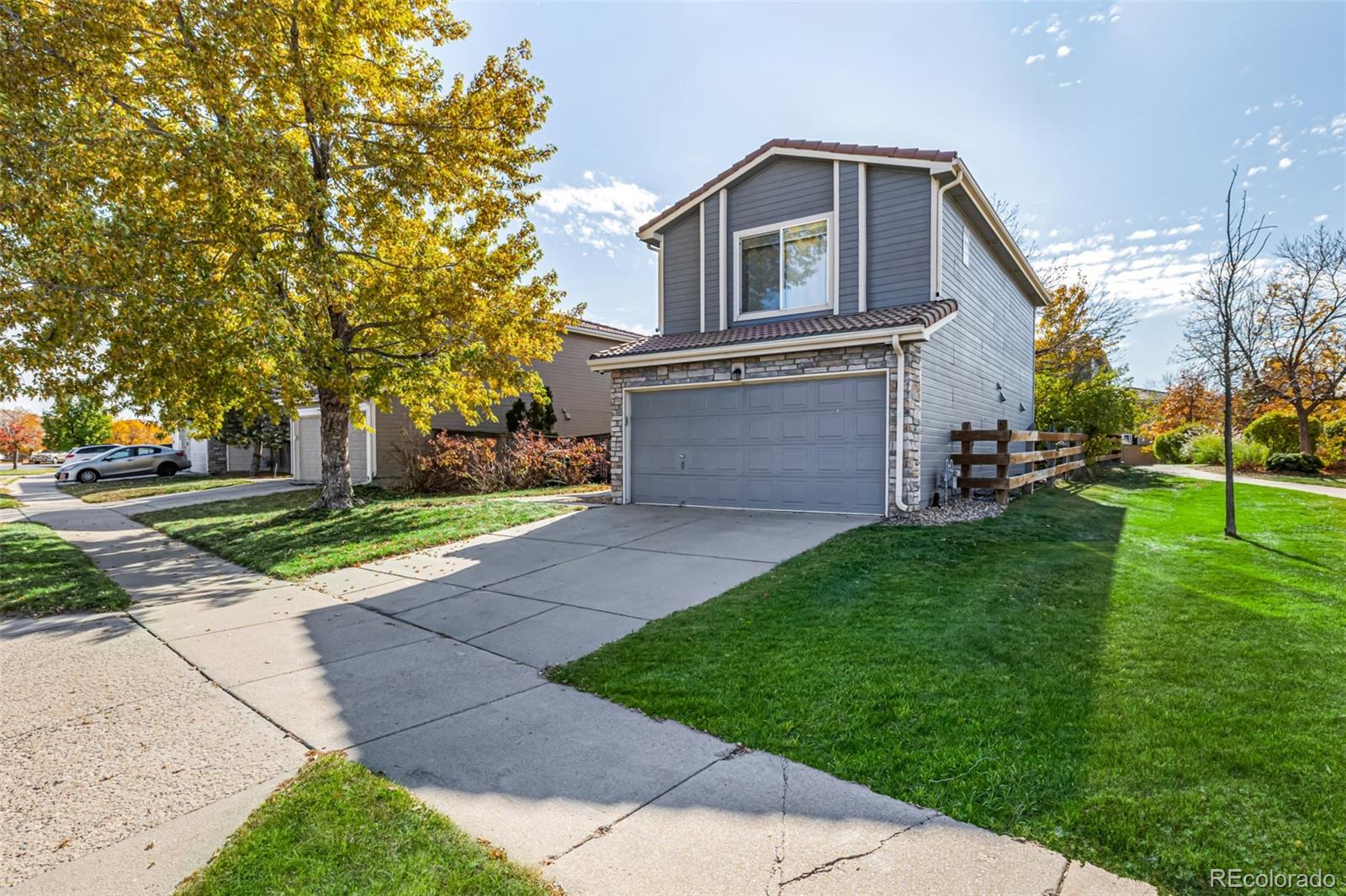 21300 East 42nd Avenue Denver, CO 80249 - Photo 1 of 48 a front view of a house with a yard