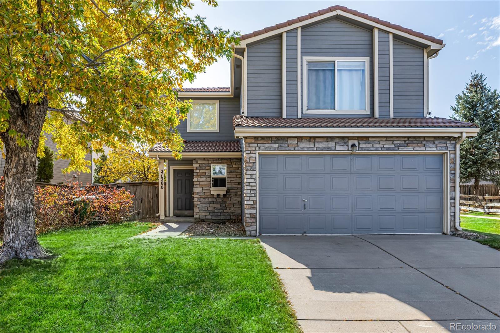 21300 East 42nd Avenue Denver, CO 80249 - Photo 2 of 48 front view of a house with a yard