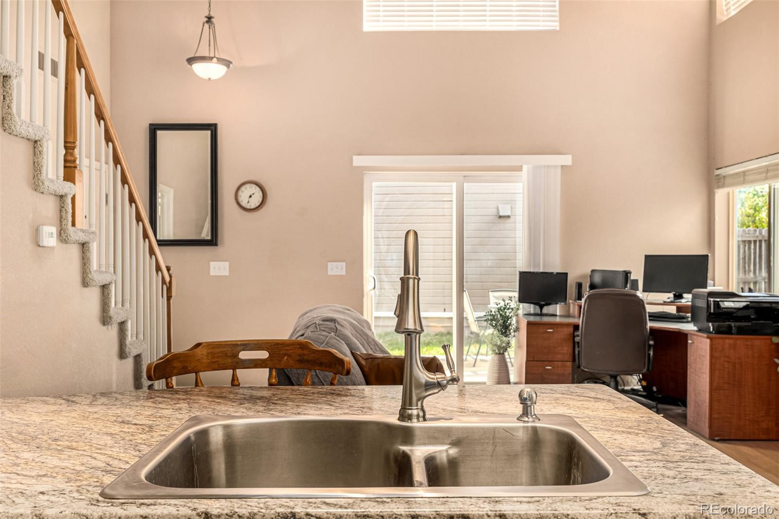 21300 East 42nd Avenue Denver, CO 80249 - Photo 21 of 48 a kitchen with a sink cabinets and a window