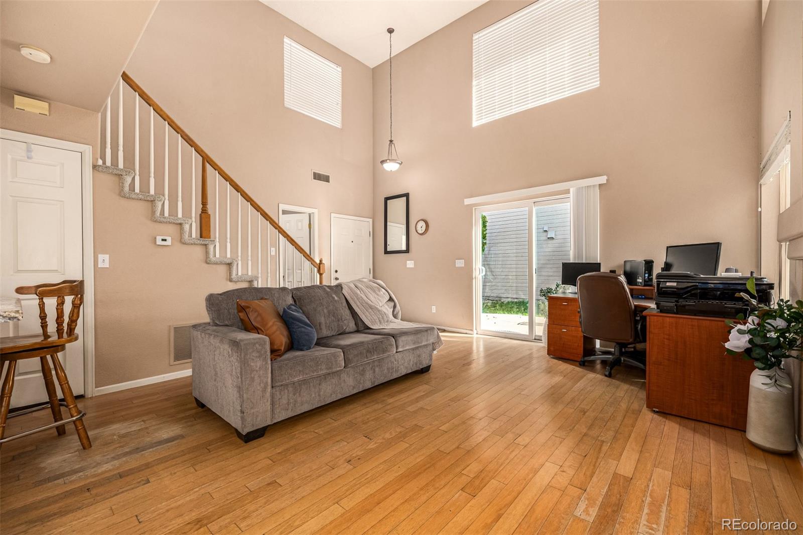 21300 East 42nd Avenue Denver, CO 80249 - Photo 24 of 48 a living room with furniture and a wooden floor