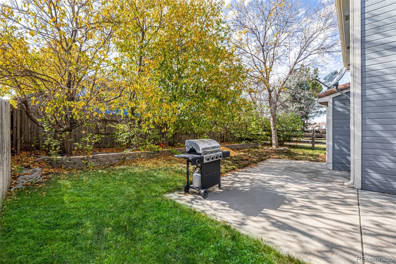 21300 East 42nd Avenue Denver, CO 80249 - Photo 27 of 48 a backyard of a house with table and chairs