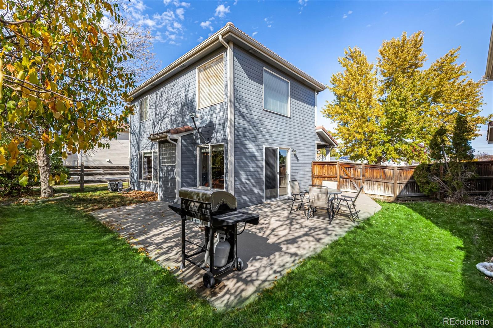 21300 East 42nd Avenue Denver, CO 80249 - Photo 28 of 48 a backyard of a house with table and chairs