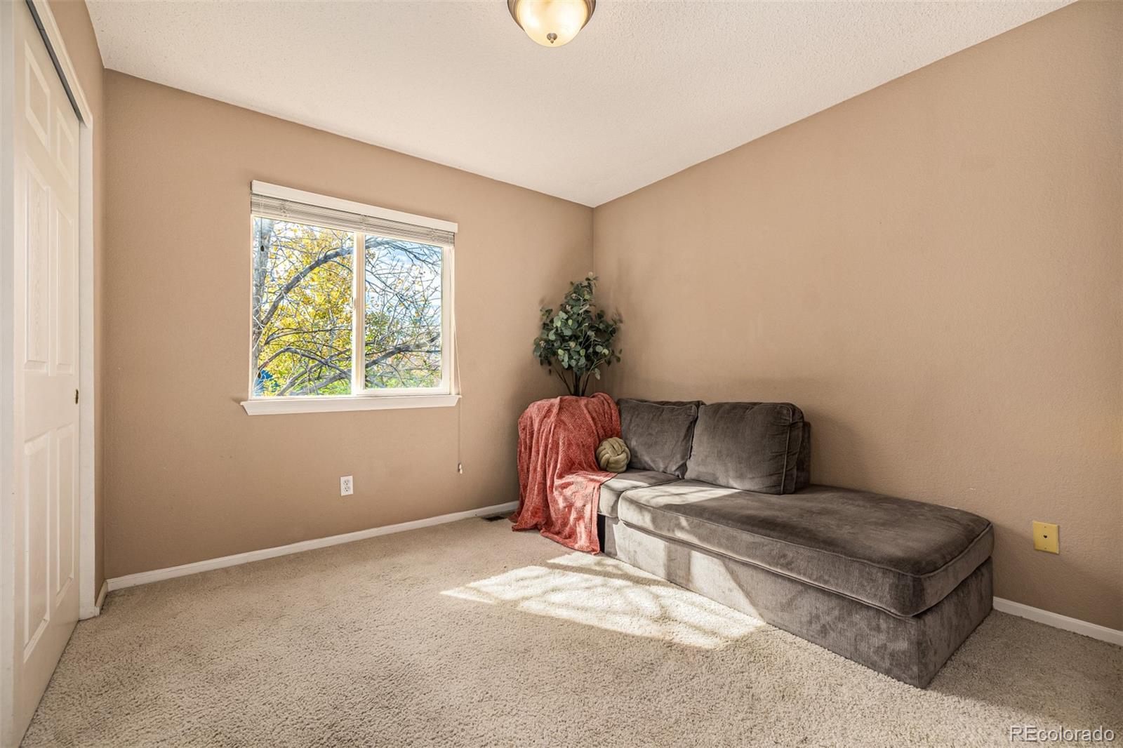 21300 East 42nd Avenue Denver, CO 80249 - Photo 31 of 48 a living room with furniture and a window