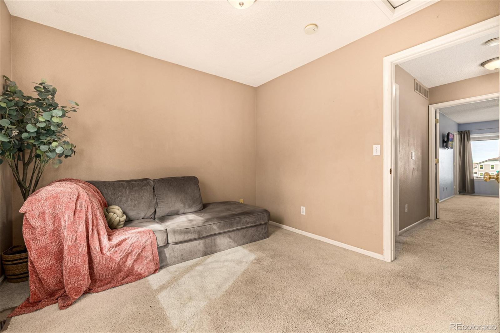 21300 East 42nd Avenue Denver, CO 80249 - Photo 32 of 48 a bed room with a bed