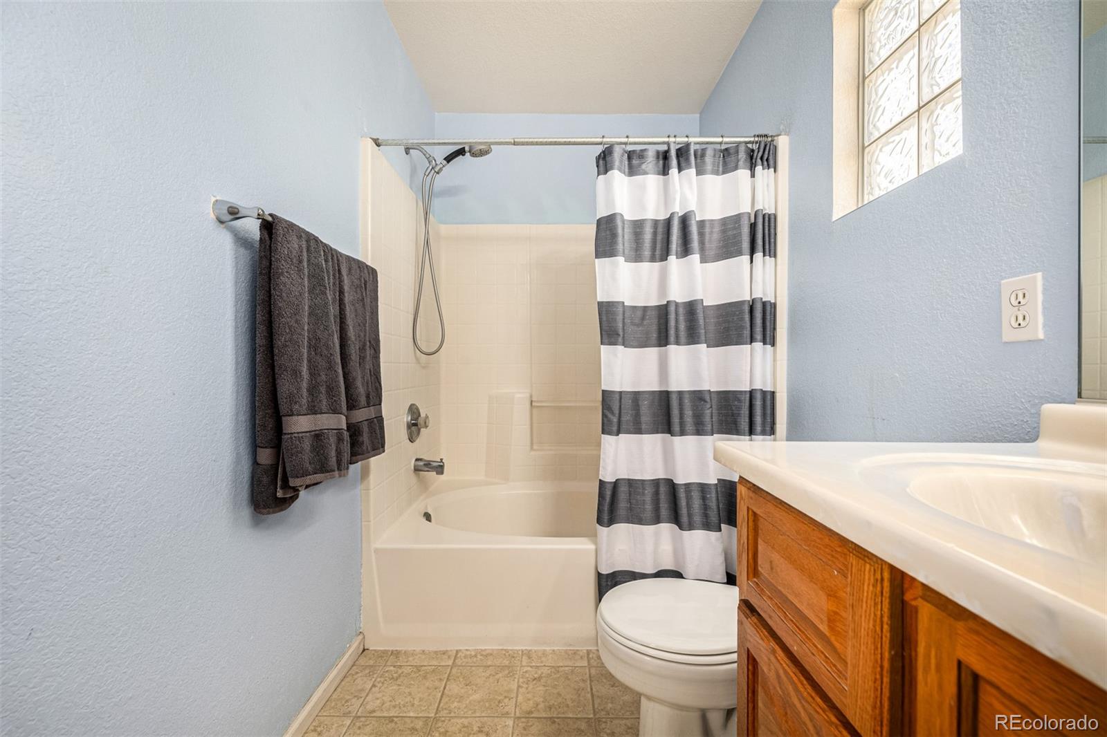 21300 East 42nd Avenue Denver, CO 80249 - Photo 38 of 48 a bathroom with a bathtub toilet and sink