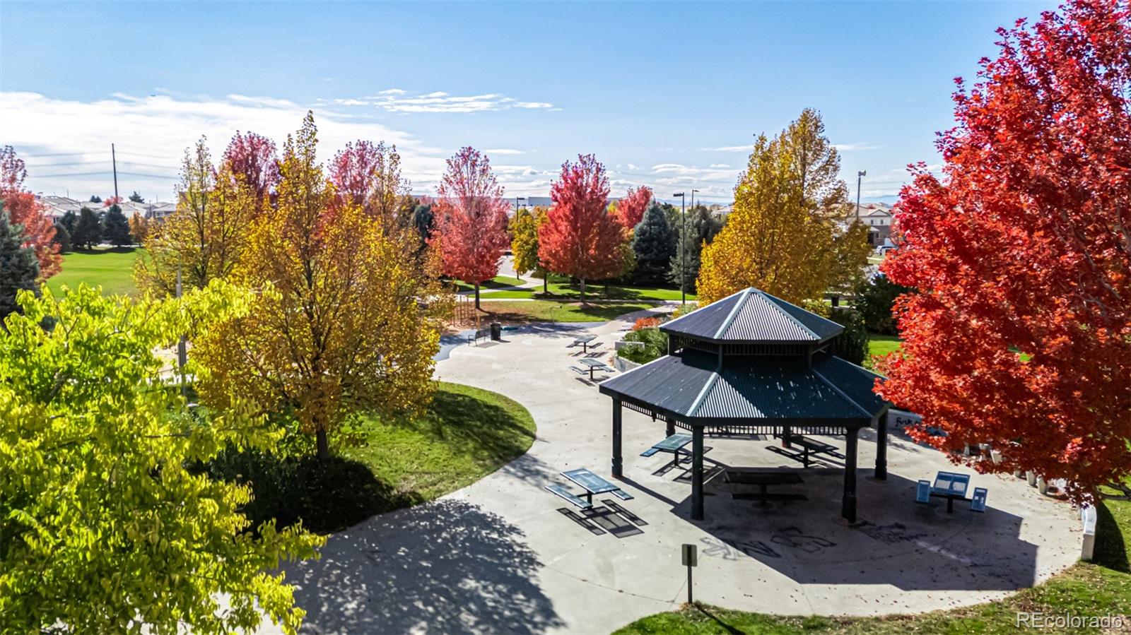 21300 East 42nd Avenue Denver, CO 80249 - Photo 4 of 48 a view of a chairs and table in backyard