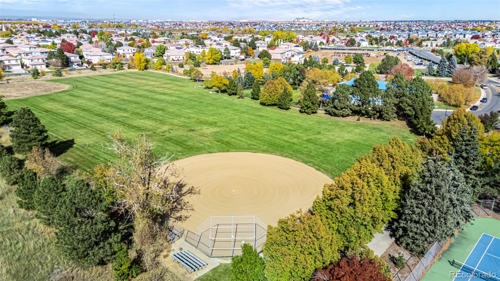 21300 East 42nd Avenue Denver, CO 80249 - Photo 46 of 48 an aerial view of residential houses with outdoor space and trees
